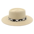 Detail view of woven boater straw hat featuring a black and white cow print decorative band - M (56-58cm) / Beige