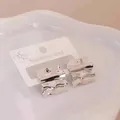 Chic silver irregular wavy stud earrings in stainless steel on white card display - Silver Irregular Wave (45)