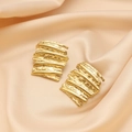 Detailed macro shot of irregular layered 18K gold plated earrings on elegant silk fabric - EH242748G Gold Layered Texture