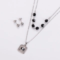 Detail of silver stainless steel jewelry set featuring evil eye pendant and beaded necklace - Steel Black