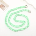 Detail of mint green acrylic phone chain with silver metal clasps on white background - Green