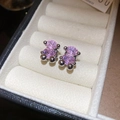 Close-up of pink gem bear earrings set in silver metal inside a cream velvet box - Pink Bear Style (HE14649)
