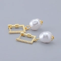 Detailed view of baroque pearl earrings with gold rectangular hoops and small white zircons - Irregular Pearl Earrings - Gold