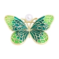Elegant gold butterfly brooch with green enamel wings and a centered pearl detail - YNCP2682 Clear Green