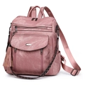 Pink PU leather backpack for women featuring fringe tassel and patterned woven strap - Pink