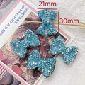 Detail shot of sparkling blue rhinestone bow bead for jewelry DIY sized 21mm by 30mm - 9# Bow - Bright Blue