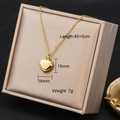 Detailed view of polished gold heart pendant with dimensions 14mm by 15mm - 7168-9/Plain Heart