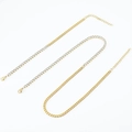 Nahaufnahme von goldener Gliederkette und Strass-Tennis-Halskette mit Karabinerverschluss - Halskette / 18K Gold