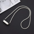 Detailed view of pearl phone strap with a sleek silver metallic pendant on black backdrop - K937 Pearl Chain Silver + Blank Clip