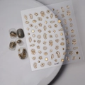 Vue détaillée des autocollants 5D dorés pour ongles aux motifs de méduses et hippocampes marins - Style Vie Marine Dorée (CO-057)