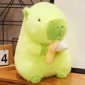 Green plush Capybara toy sitting on a desk and holding a yellow banana plush toy - Green (Relaxed Style) / 30 cm