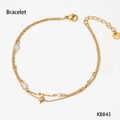 Double-layered gold stainless steel bracelet with white pearls and star charm - Gold Bracelet (KB843)