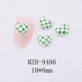 Macro shot of 10x8mm green checkered heart nail charms with silver alloy plating - Green White Checkerboard Silver Edge Large (9486)