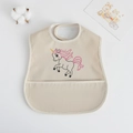 Waterproof baby bib in beige with unicorn print and crumb catcher pocket - Pu Bib (double-layered) - Pink Unicorn / One Size
