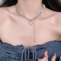 Elegant pearl and silver chain necklace featuring a round rhinestone pendant with tassel - 5761482237585 / Pearl Tassel Patchwork Necklace (X1612) / Silver/White