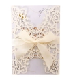Detail of laser-cut ivory invitation card featuring a glitter finish and satin ribbon bow - Glitter Iridescent Ivory