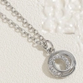 Elegant silver necklace featuring geometric double ring pendant with zircon accents - Interlocking Rings (Platinum Plated)