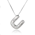Detailed macro shot of silver horseshoe pendant necklace with inlaid clear cubic zirconia - Letter U