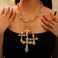 Close-up of layered gold necklaces with cross pendants and colorful gemstones - 0112+2386 Multi-Cross Pearl Gemstone Layered Style