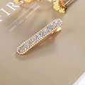 Golden hair clip with rows of sparkling clear crystals on beige card background - Rectangular Press Clip / White