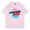 Pink crew neck t-shirt with July 4th Independence Day print in a flat lay view - Pink