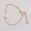 Elegant rose gold chain bracelet featuring a round pendant with engraved letter N - Rose Gold N