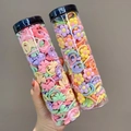 Détail d'élastiques colorés pour enfants avec fleurs et nœuds dans deux tubes transparents - Styles Mixtes Aléatoires / Ensemble de 40 Pièces