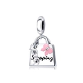 Macro shot of silver handbag charm with pink bow and Shopping text detail - Handbag Glasses