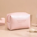 Pink waterproof cosmetic travel bag with zipper closure and embossed silver text - Pink (Octagonal)