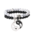 Close-up of black matte and white turquoise beads with a Yin Yang split charm pendant - White Howlite + Matte Black Set