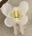 Translucent cream butterfly hair claw clip with golden spring on linen fabric - Jelly White