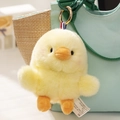 Cute yellow plush chick bag charm with soft fur and orange details on green bag - Yellow Chicken