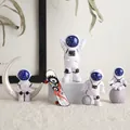 Set di statuine da astronauta con visiere blu navy e mini skateboard sulla scrivania - Set da 4 Pezzi Blu Cielo Stellato + Skateboard