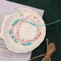 Detail of bohemian multi-layer beaded bracelets with turquoise and evil eye charm in a shell tray - Style 50-4pcs Multi Evil Eye