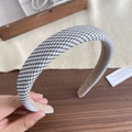 Padded headband featuring black and white houndstooth fabric with soft beige inner lining - Black and White Houndstooth