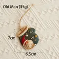 Pendentif vintage Père Noël en résine avec texte HO HO sur fond texturé blanc - Père Noël