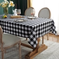 Classic black and white gingham tablecloth made of polyester-cotton blend on a table - Black and White Plaid