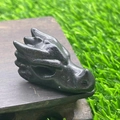 Detailed black natural stone dragon head sculpture on a wooden base - Plum Blossom Jade