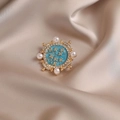 Vintage round alloy brooch featuring sky blue enamel with gold floral and pearls - 545#