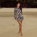 Close-up of zebra print fabric texture and long sleeve detail on a slim fit mini dress - S / Black and White
