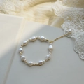 Irregular freshwater pearl bracelet with golden beads and an elegant extension chain - Style 2