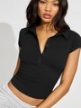 Close-up of black short-sleeved polo knit top with button placket and slim fit detail - S / Black