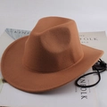Brown felt cowboy hat with adjustable wind cord on stylish Kinfolk magazine - Plain Style / Caramel