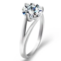 Classic silver ring featuring a round blue zircon in a four-prong V-shape setting - Minimalist Four-Prong Silver Style