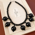 Detail of glossy black acrylic beaded fringe necklace with lobster clasp and chain - Black Round Bead Tassel Necklace (WN2254)