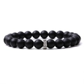 Macro shot of matte black stone beads with a textured silver metal cylinder charm - Matte Onyx