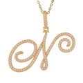 Close-up of golden cursive letter pendant with micro-paved sparkling cubic zirconia - N (Gold)