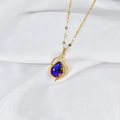 Elegante goldene Wassertropfenkette mit lila-blauem Kristall und Zirkonia-Inlay - Schillernder Wassertropfen