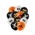 Close-up of Halloween latex balloons with pumpkin, ghost, and skull patterns in orange and black - 24 Balloons Per Pack