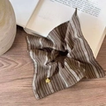 Brown fabric hair scrunchie with white patterns and heart pendant on a wooden table - Vintage Stripe Coffee